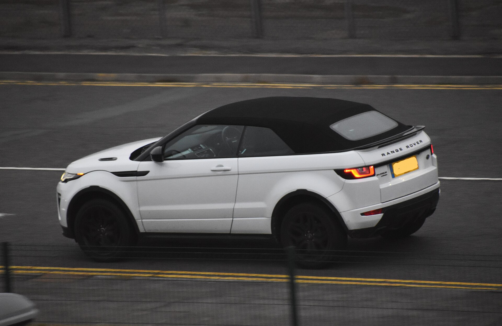 Range Rover Evoque Cabriolet with roof down, front three-quarter view