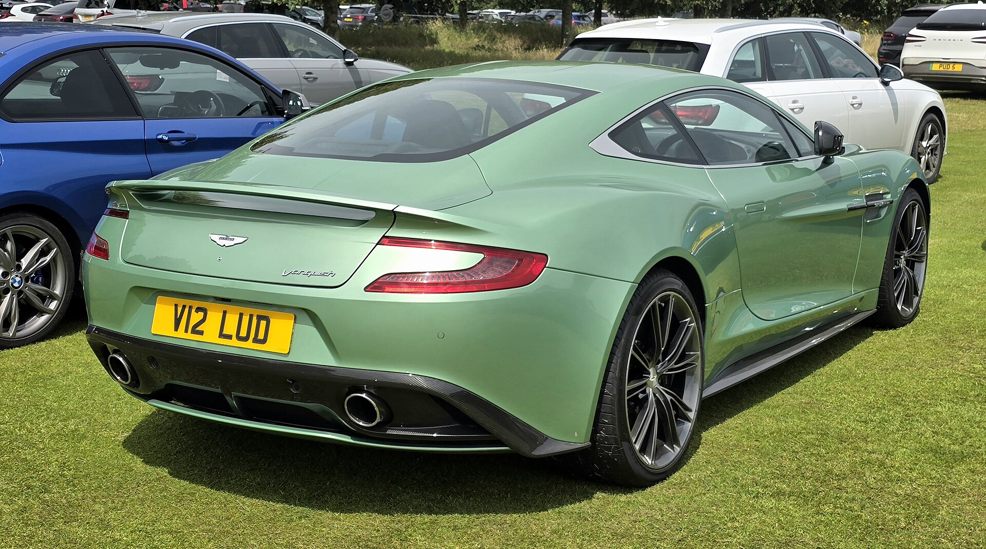2012 Aston Martin Vanquish photographed in an auto show setting.