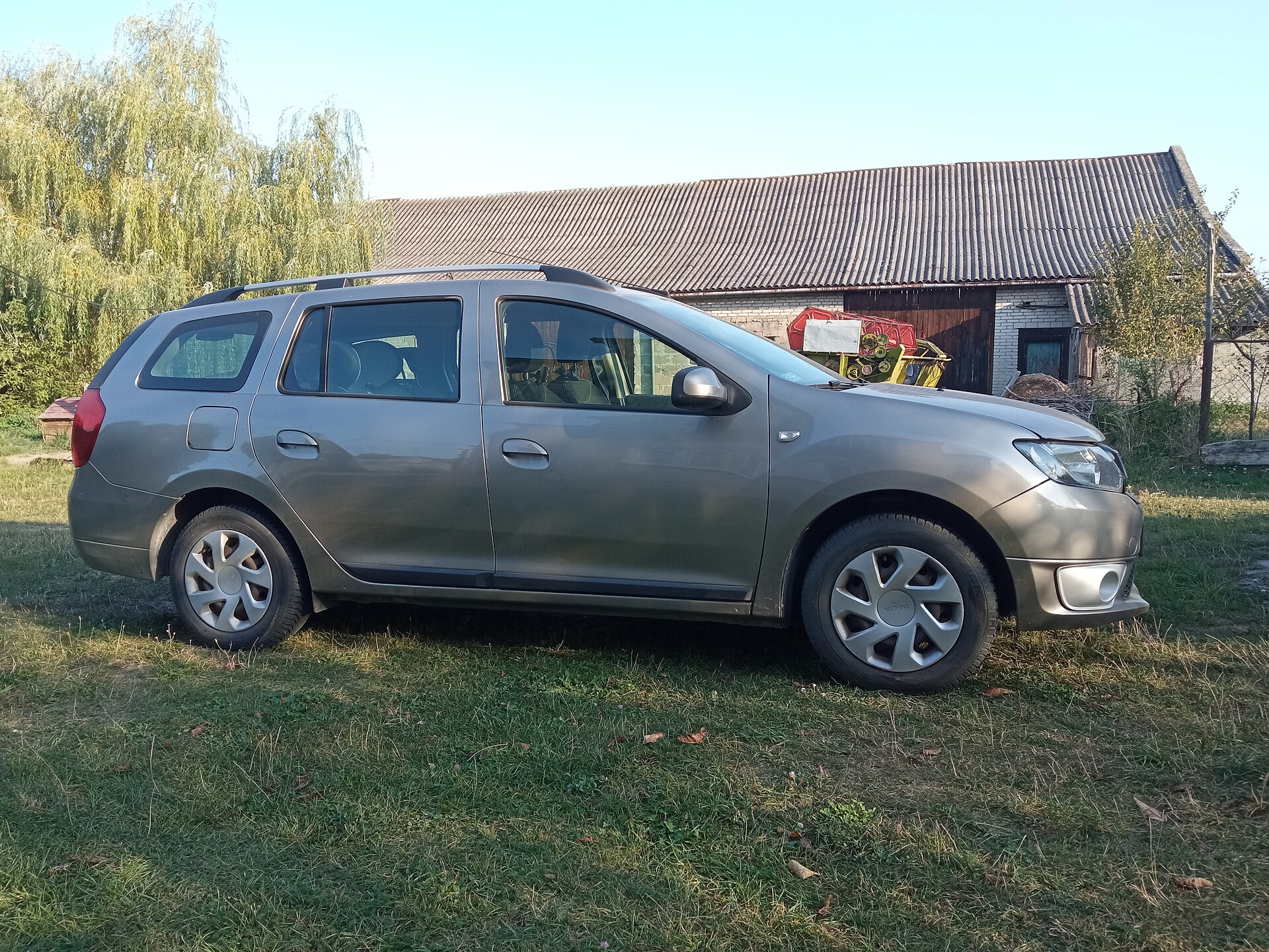 Dacia Logan MCV II estate on a Polish countryside road, 2024