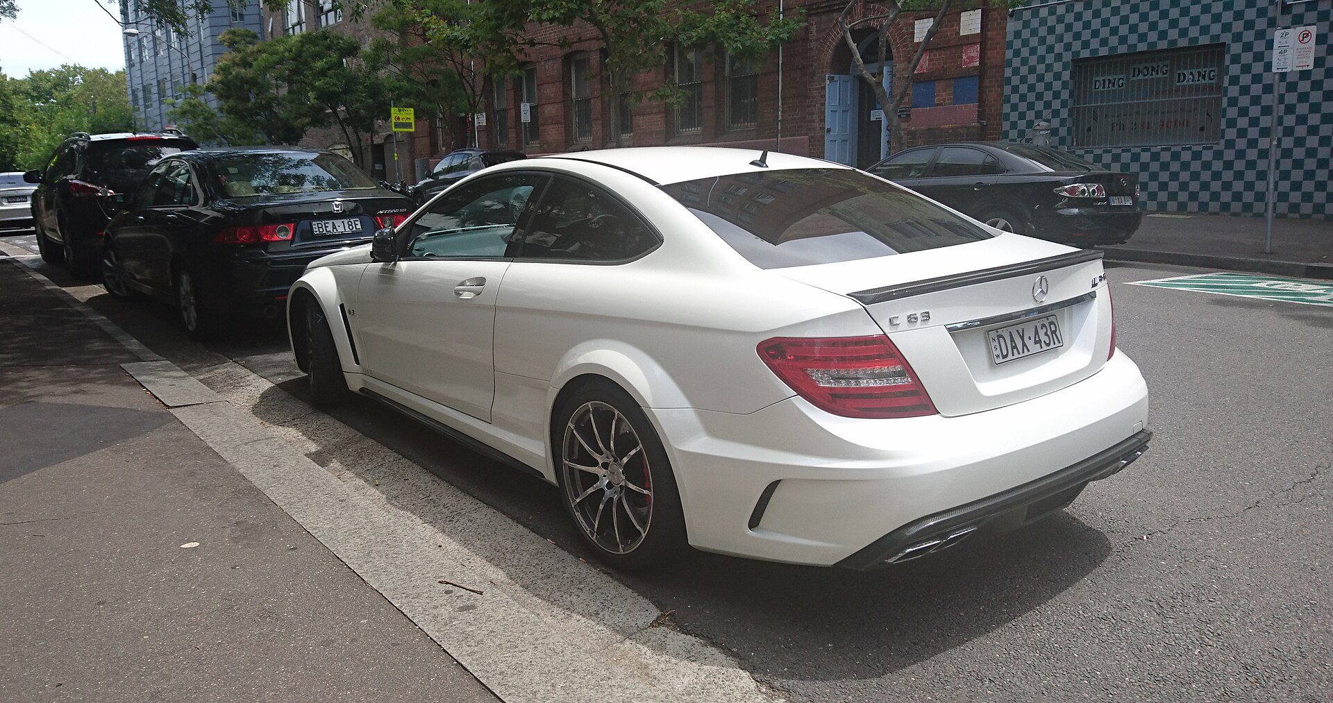 Mercedes-Benz C63 Coupe AMG (2016) in silver, front three-quarter view.