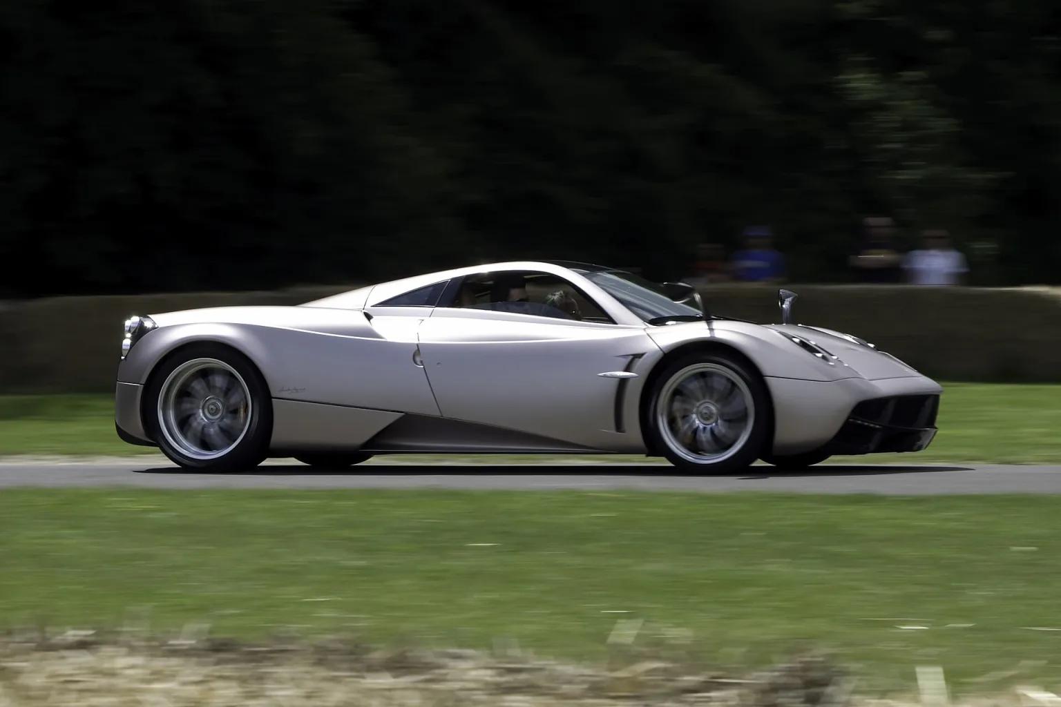 Pagani Huayra at a car show, front three-quarter view.