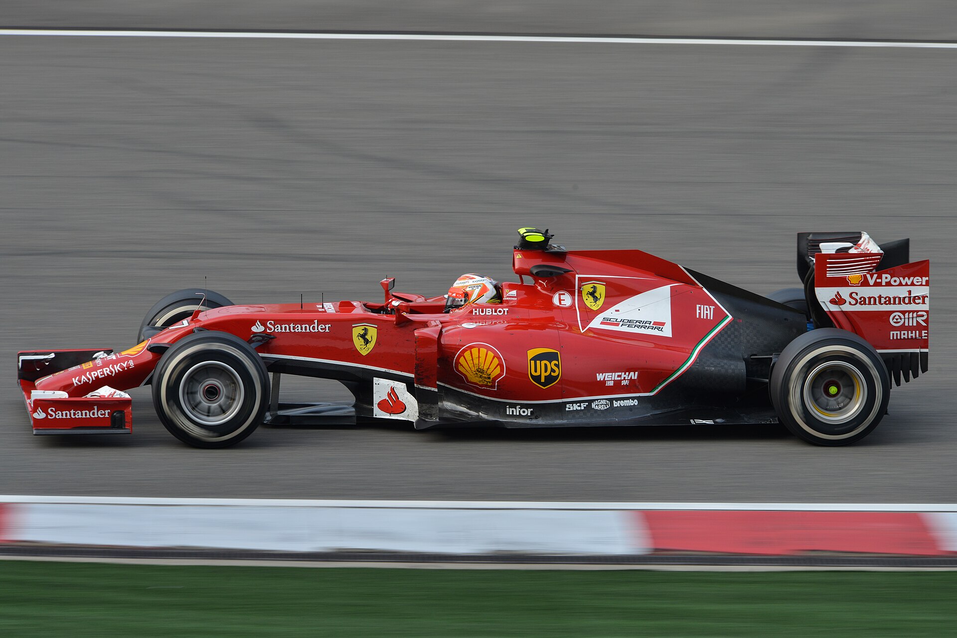 Kimi Raikkonen driving the Ferrari F14 T in the 2014 F1 season.