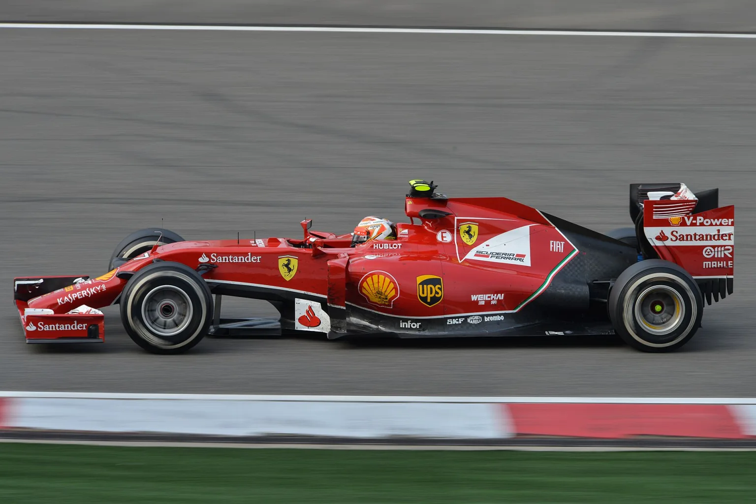 Kimi Raikkonen driving the Ferrari F14 T in the 2014 F1 season.