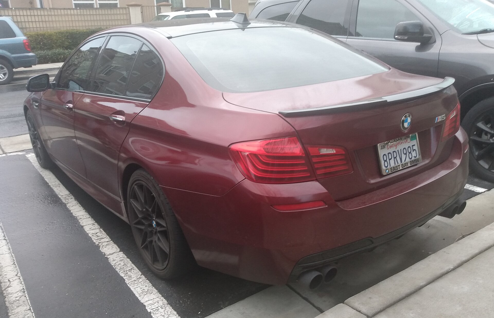 2013 BMW M5 (F10) in blue, front three-quarter view