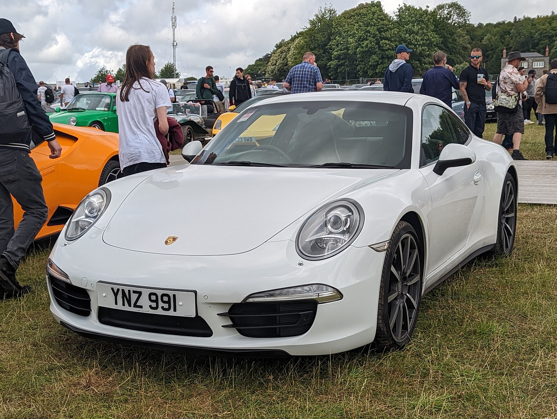 2013 Porsche 911 Carrera 4 in silver, front three-quarter view