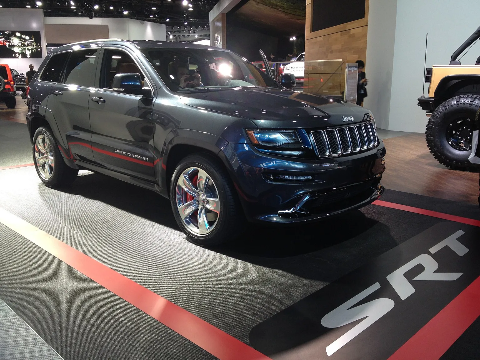 2014 Jeep Grand Cherokee SRT in silver, front three-quarter view
