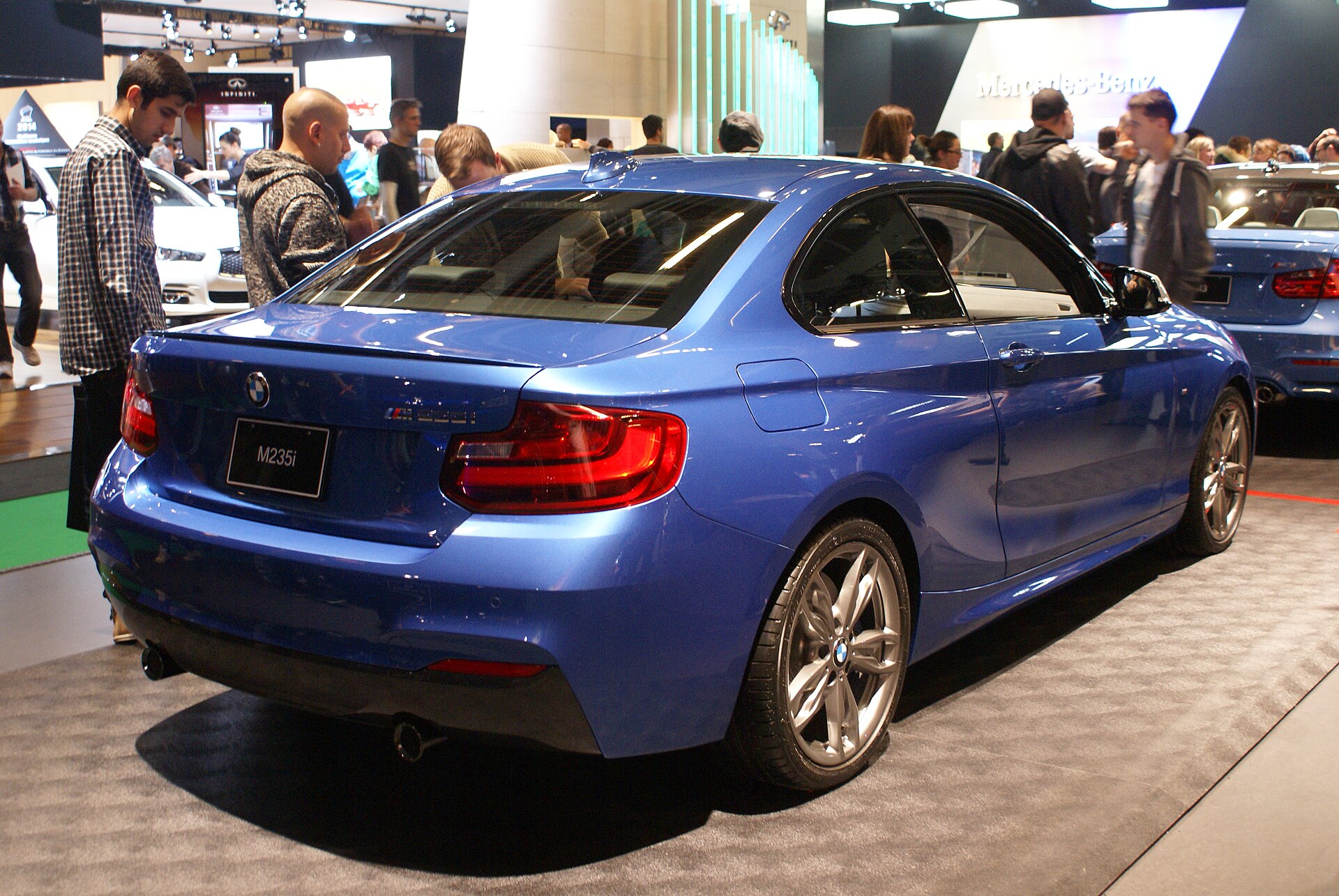 Blue BMW M235i (F22) at the 2014 MIAS, rear view.