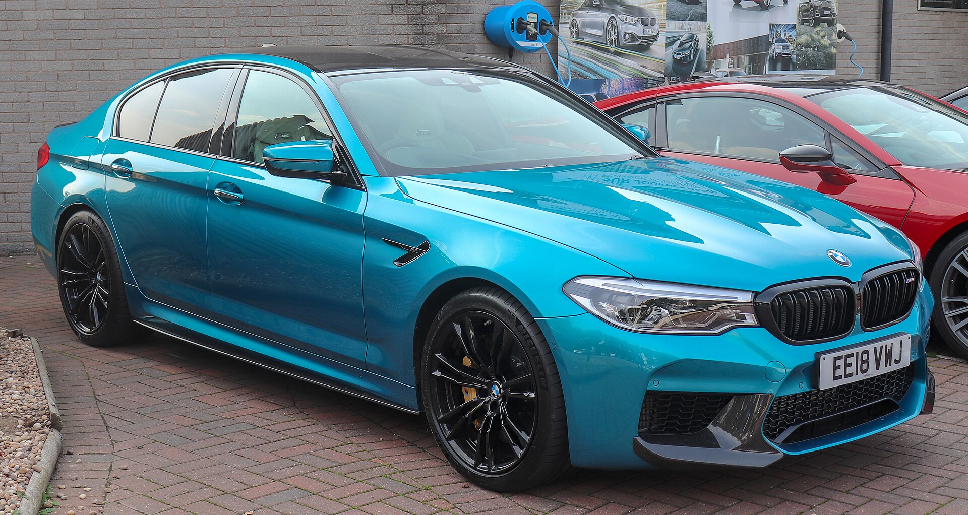 2018 BMW M5 (F90) in blue, front three-quarter view