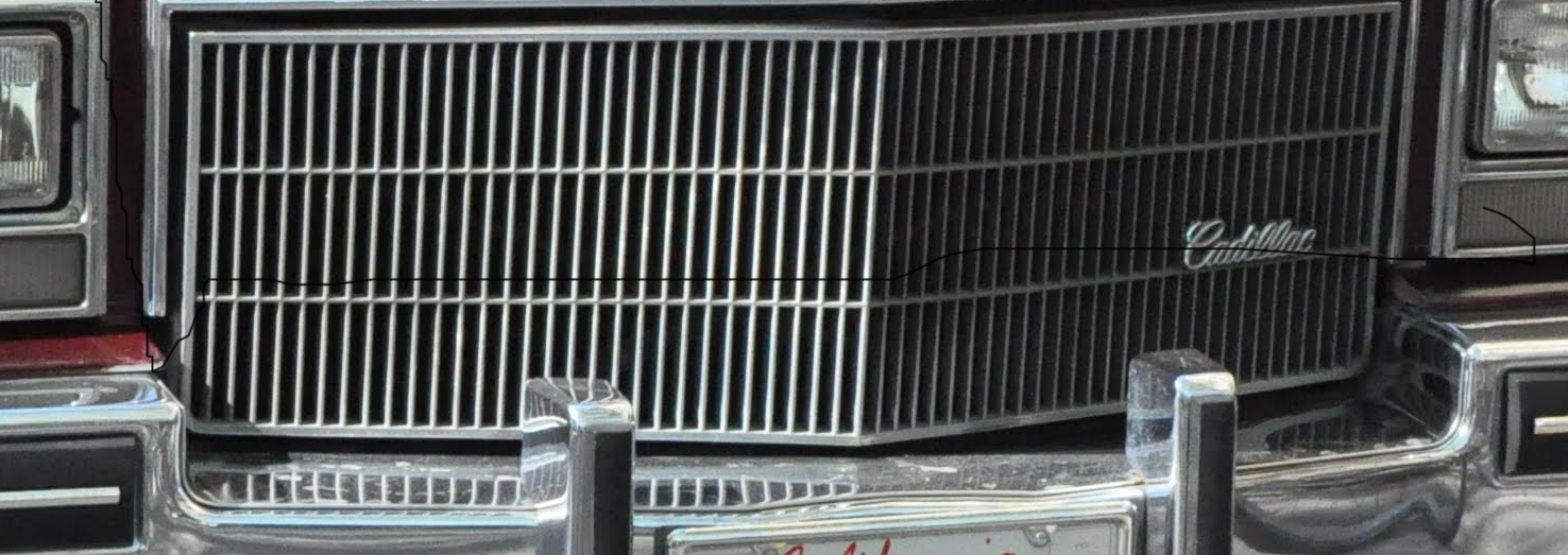 Cadillac grille from 2015, representing the brand's modern vehicles.