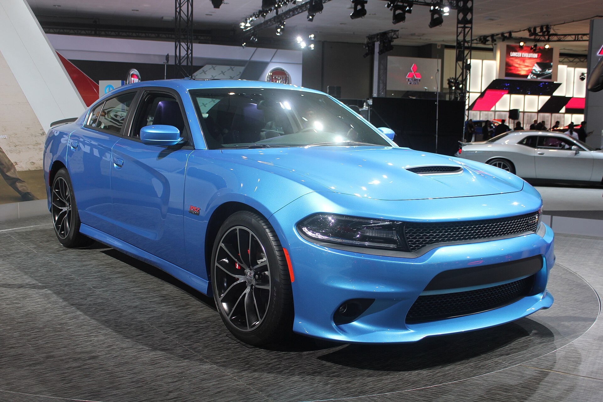 2015 Dodge Charger SRT 392 with Scat Pack in red, front view.
