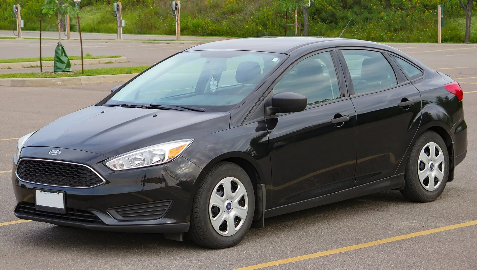 2015 Ford Focus S Sedan in Tuxedo Black, front left view
