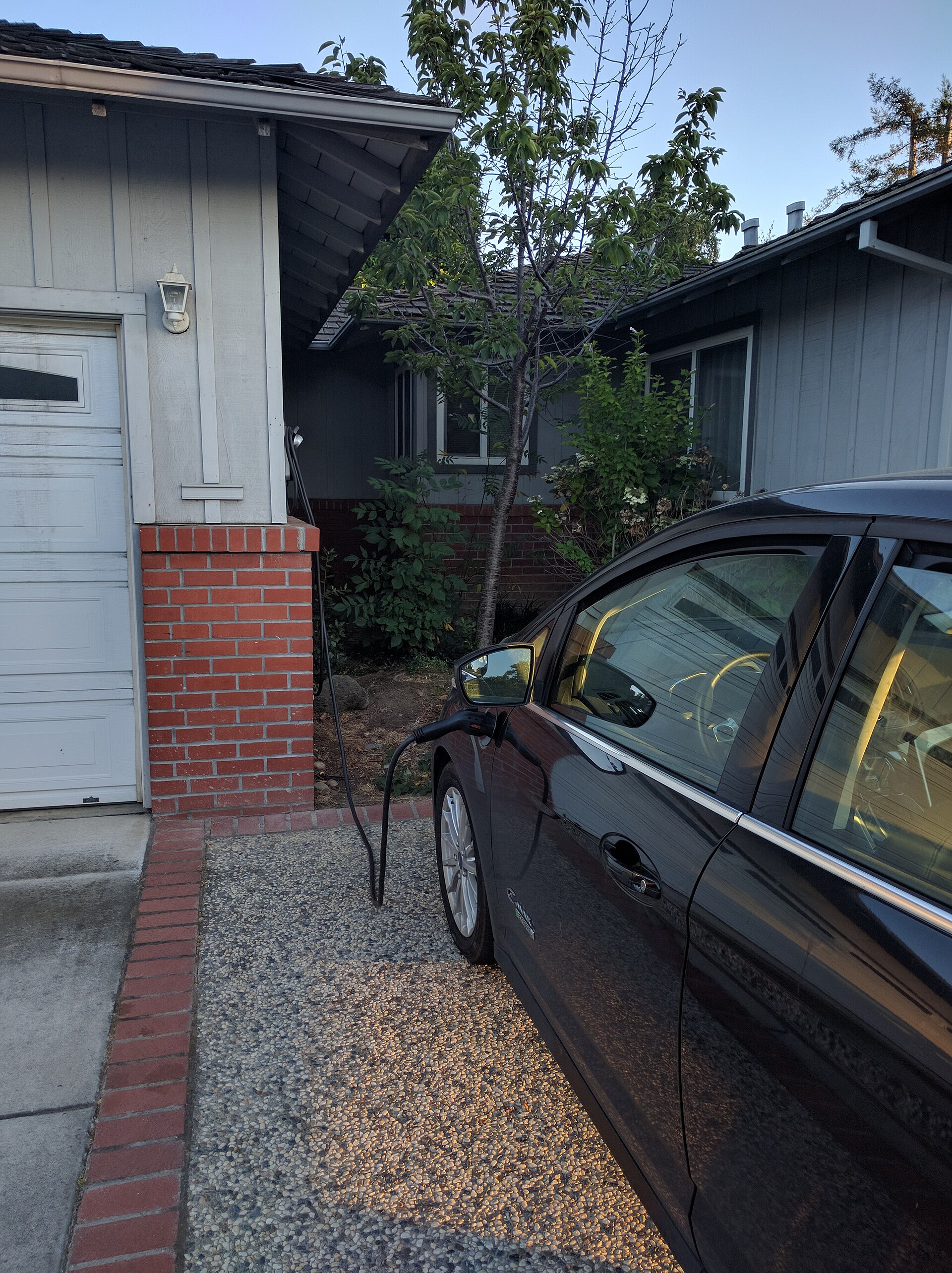 Ford C-Max Energi charging in a driveway