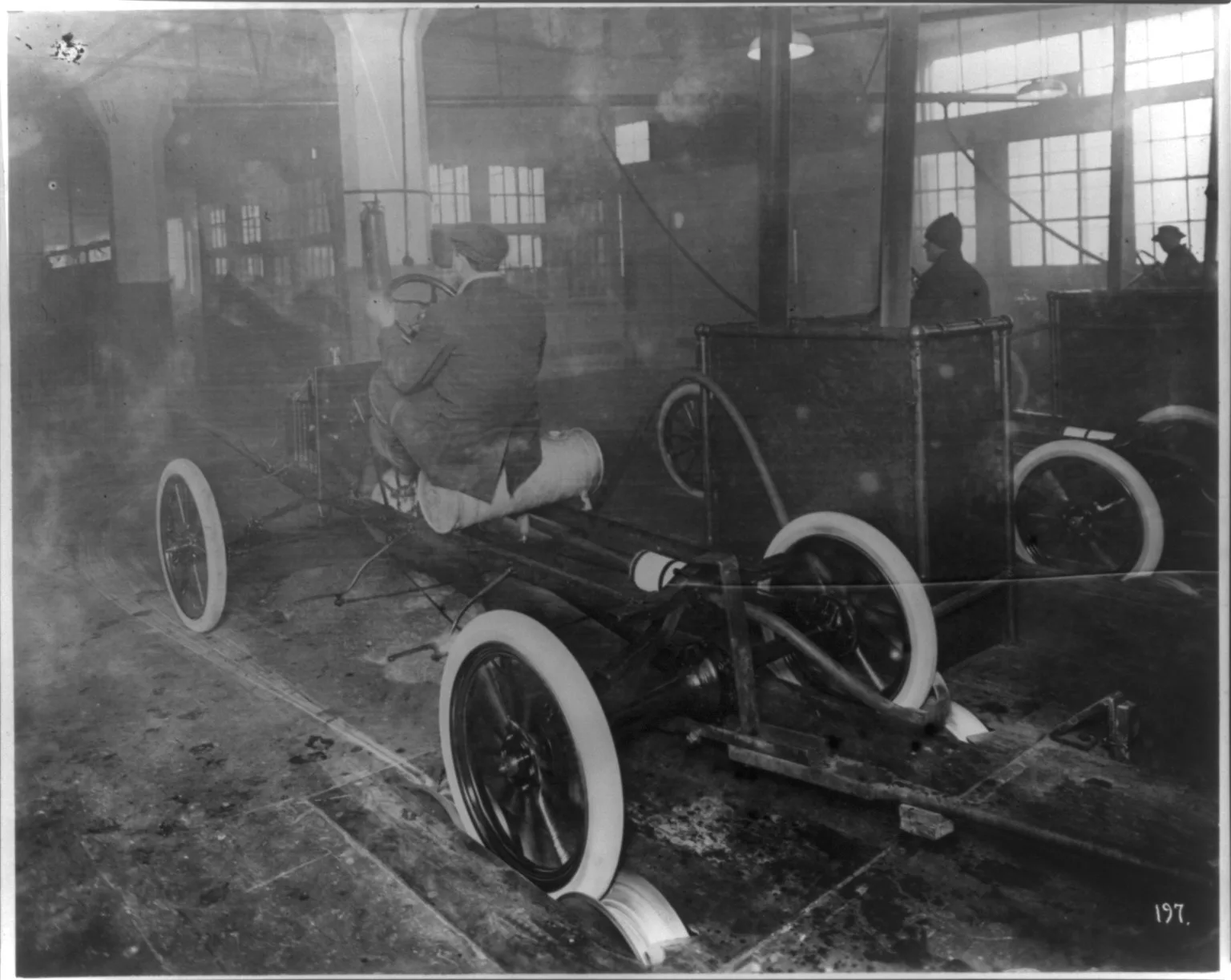 Model T's coming off the assembly line at Highland Park plant, c. 1913.