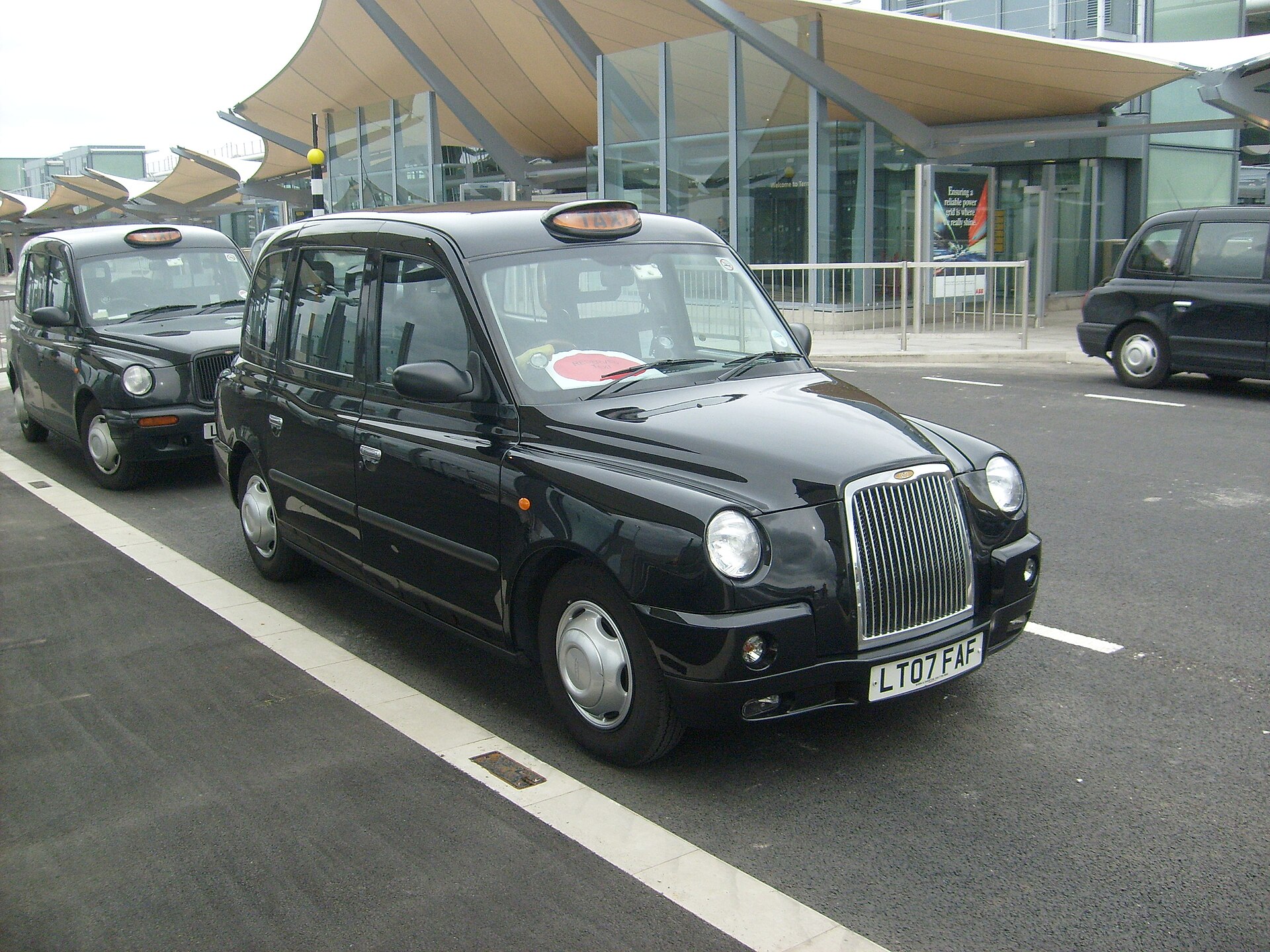 A TX4 taxi at Heathrow Airport Terminal 5.