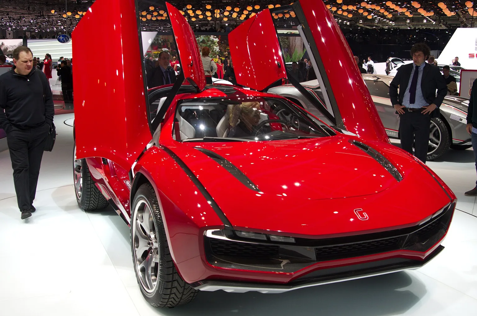 Italdesign Giugiaro Parcour XGT-Coupe, red, front view at Geneva Motor Show 2013.