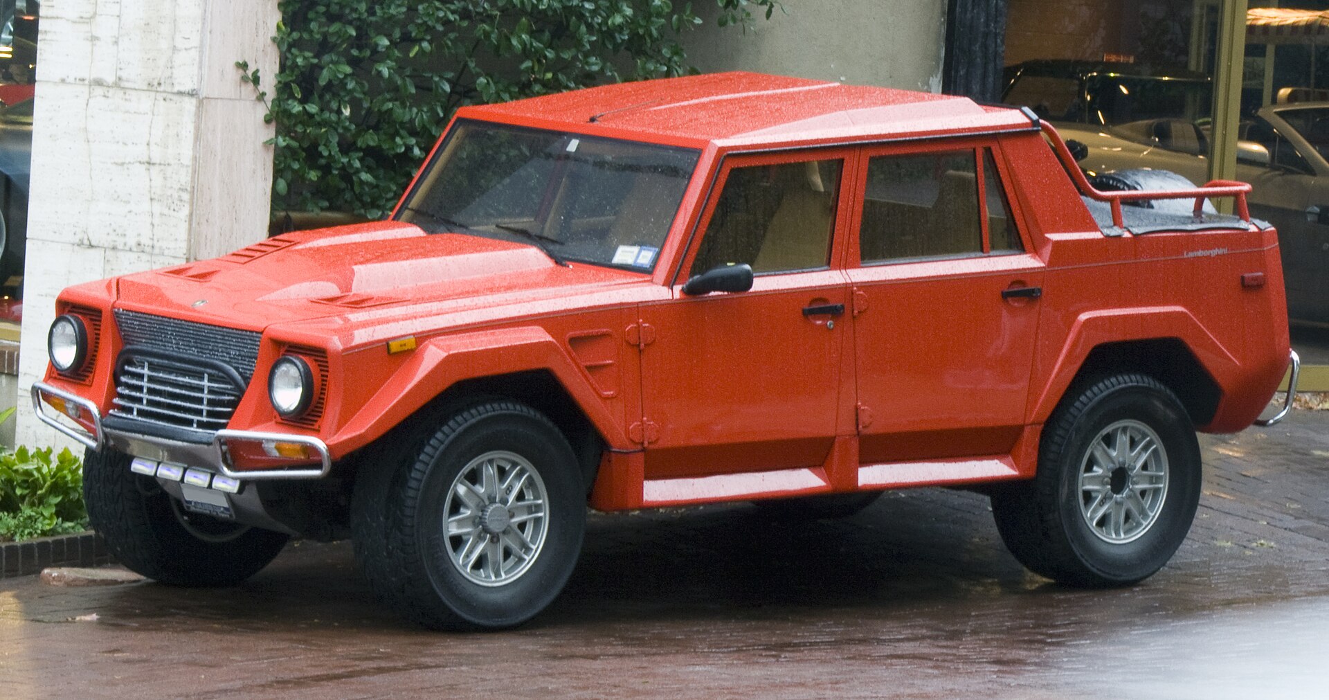 1990 Lamborghini LM002 in red, front left view.