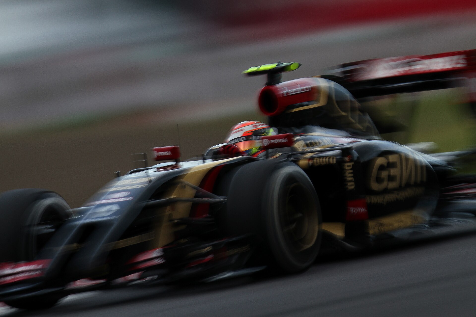 Pastor Maldonado driving the Lotus F1 car, number 13.