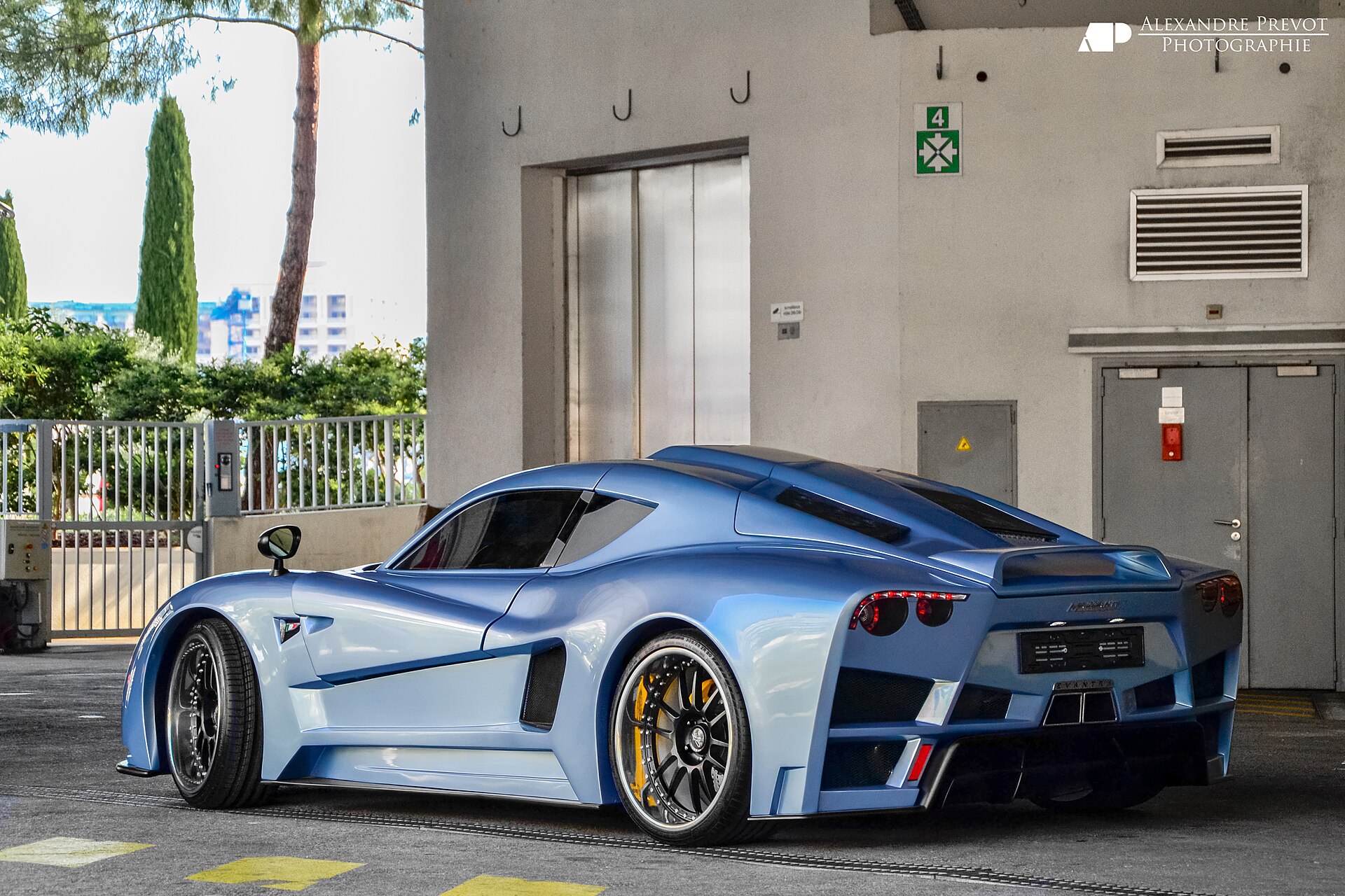 Mazzanti Evantra V8 at an auto show, front and side view.