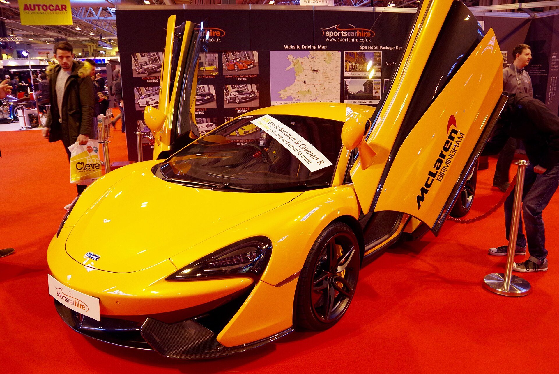 Blue McLaren P1 at a car event, 2015-era model.