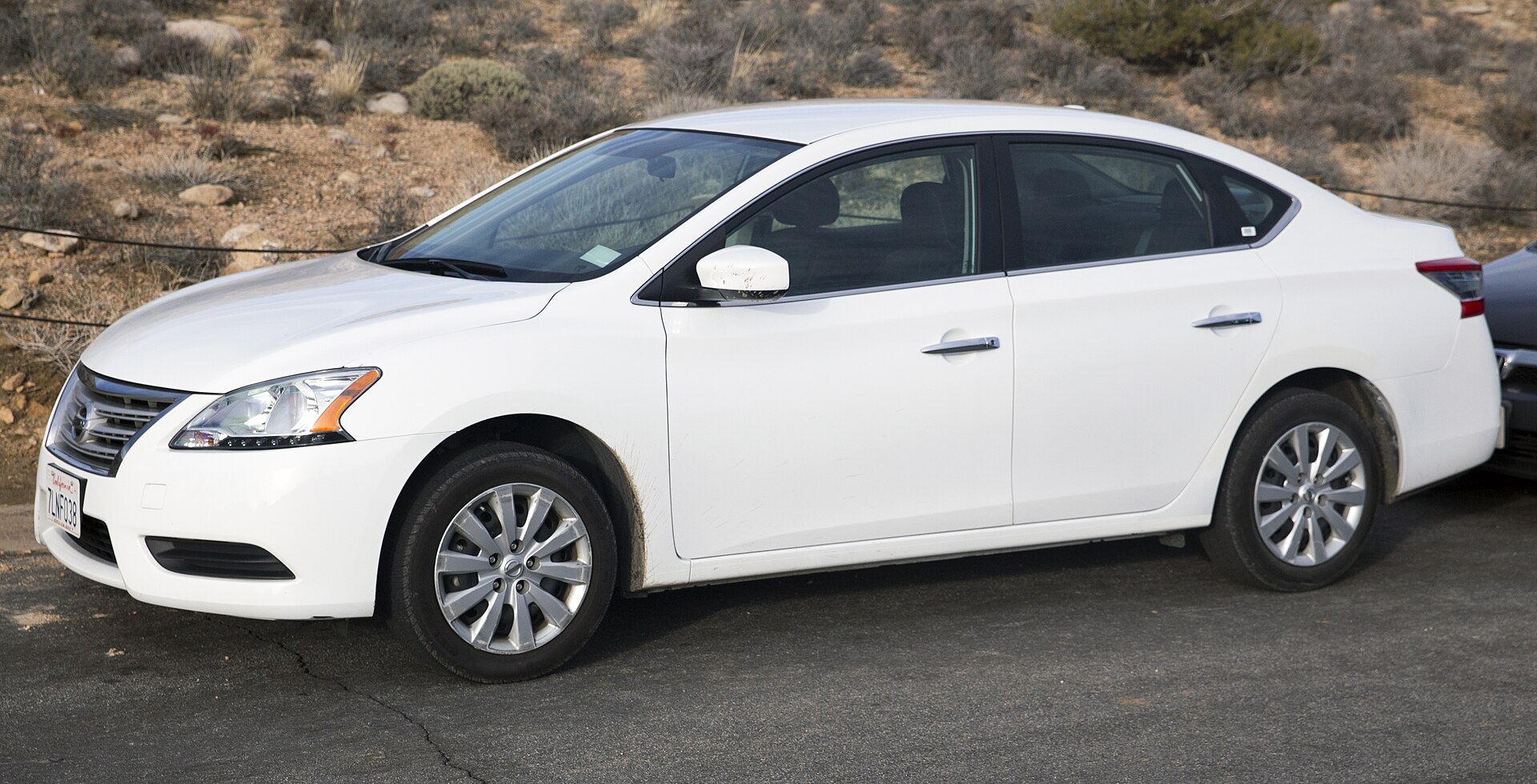 2015 Nissan Sentra S (6MT), front left view