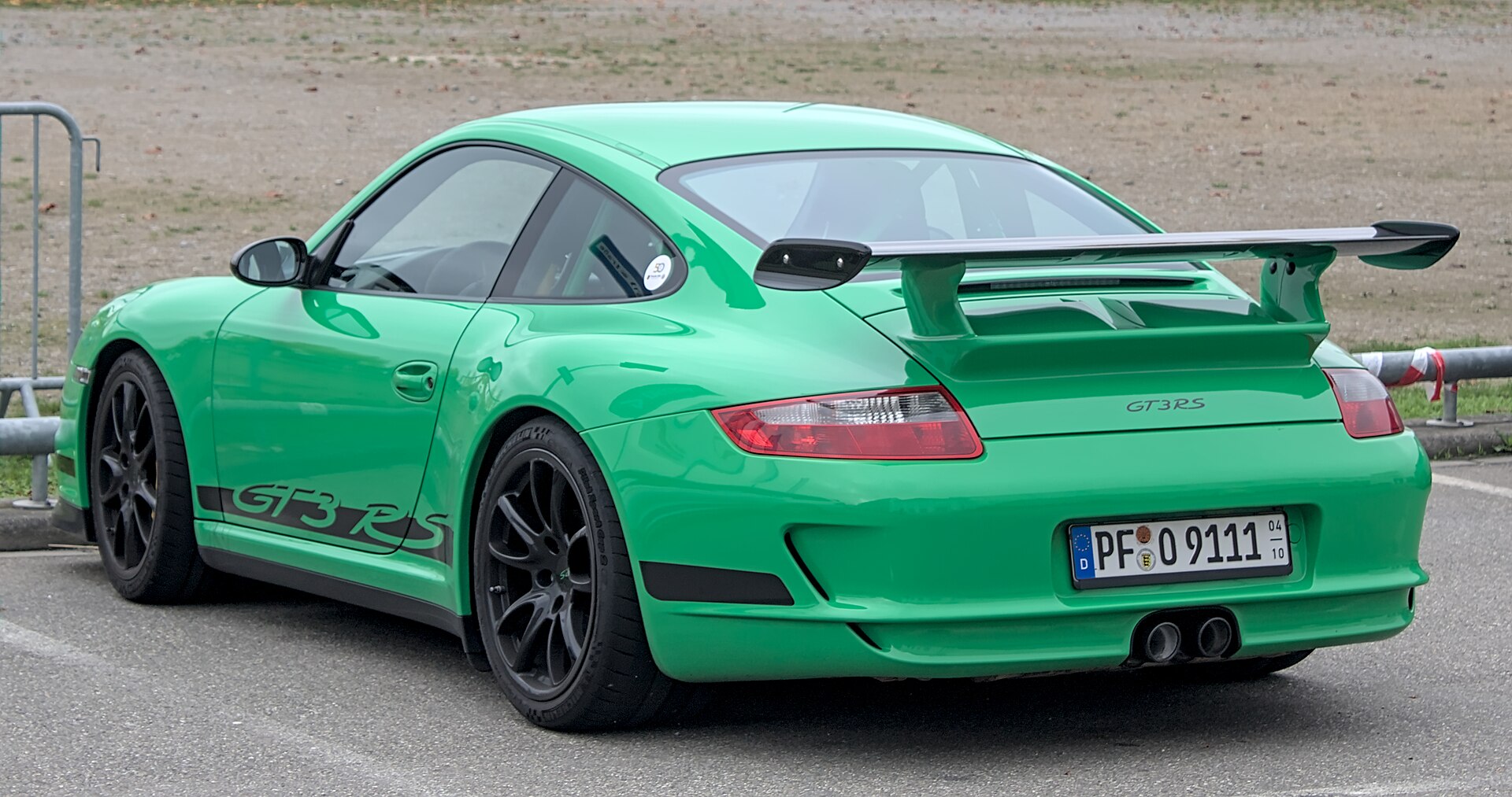 Porsche 997 GT3 RS (2006) at an event, front three-quarter view.