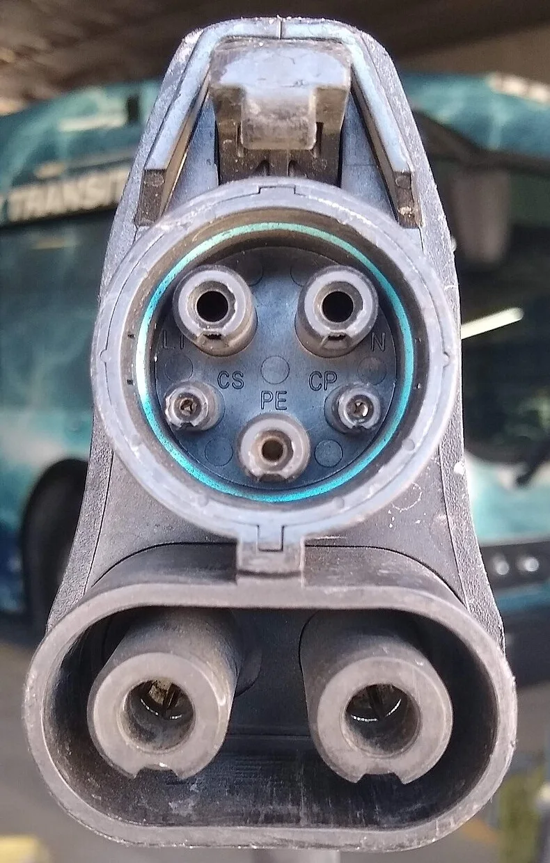 Front view of a CCS1 (SAE J1772 Combo) charging connector.