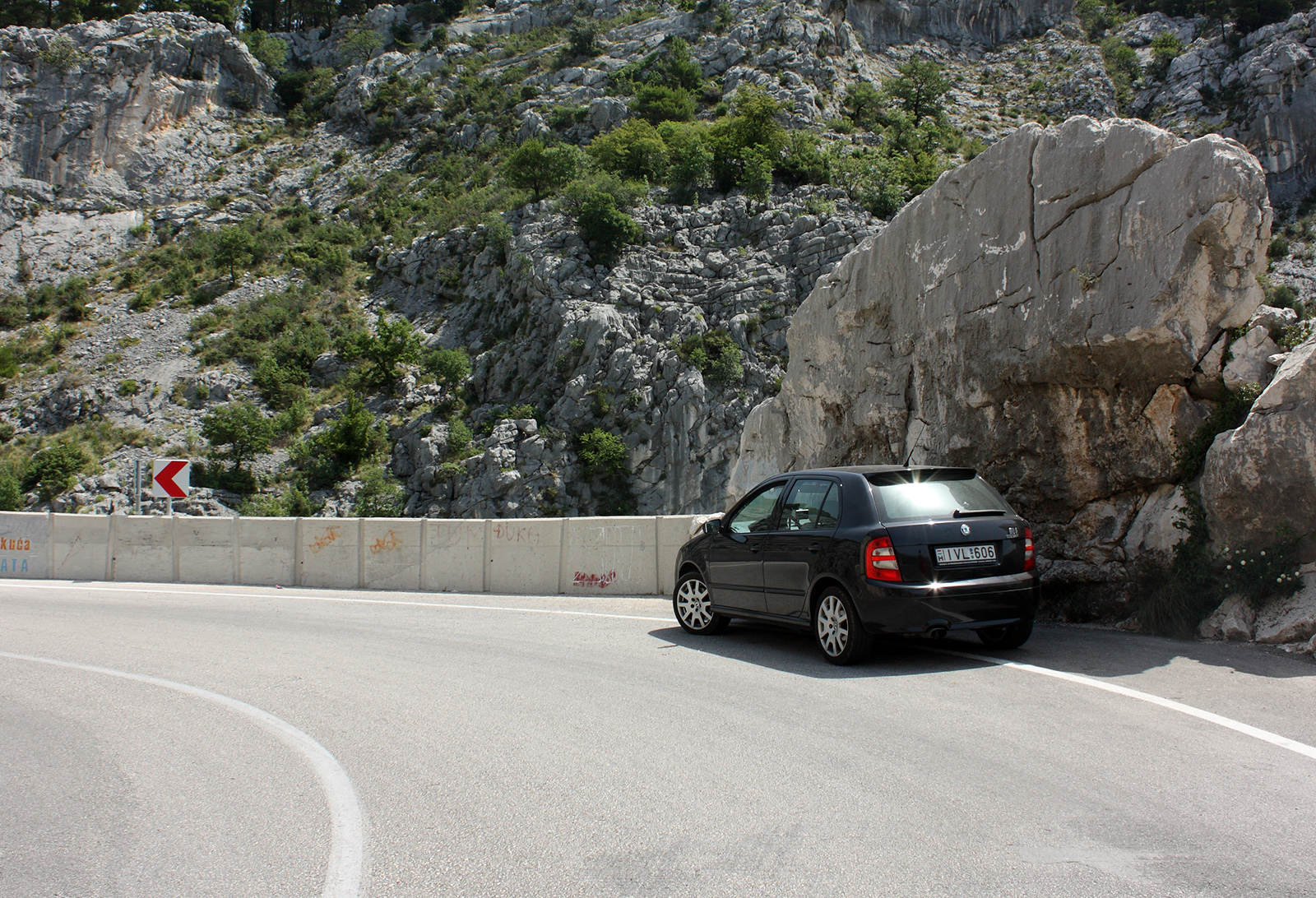 2012 Skoda Fabia RS hot hatch in green, front three-quarter view.