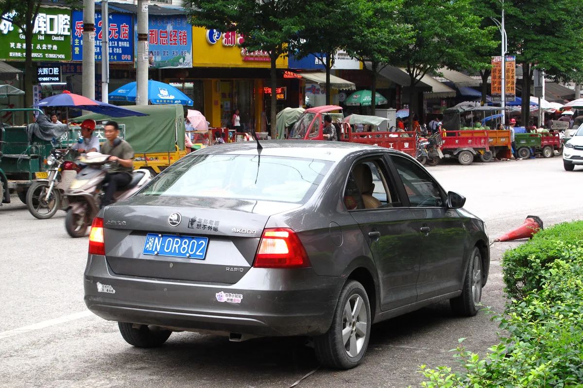 Rear view of a Škoda Rapid, matching the 2013 model period.