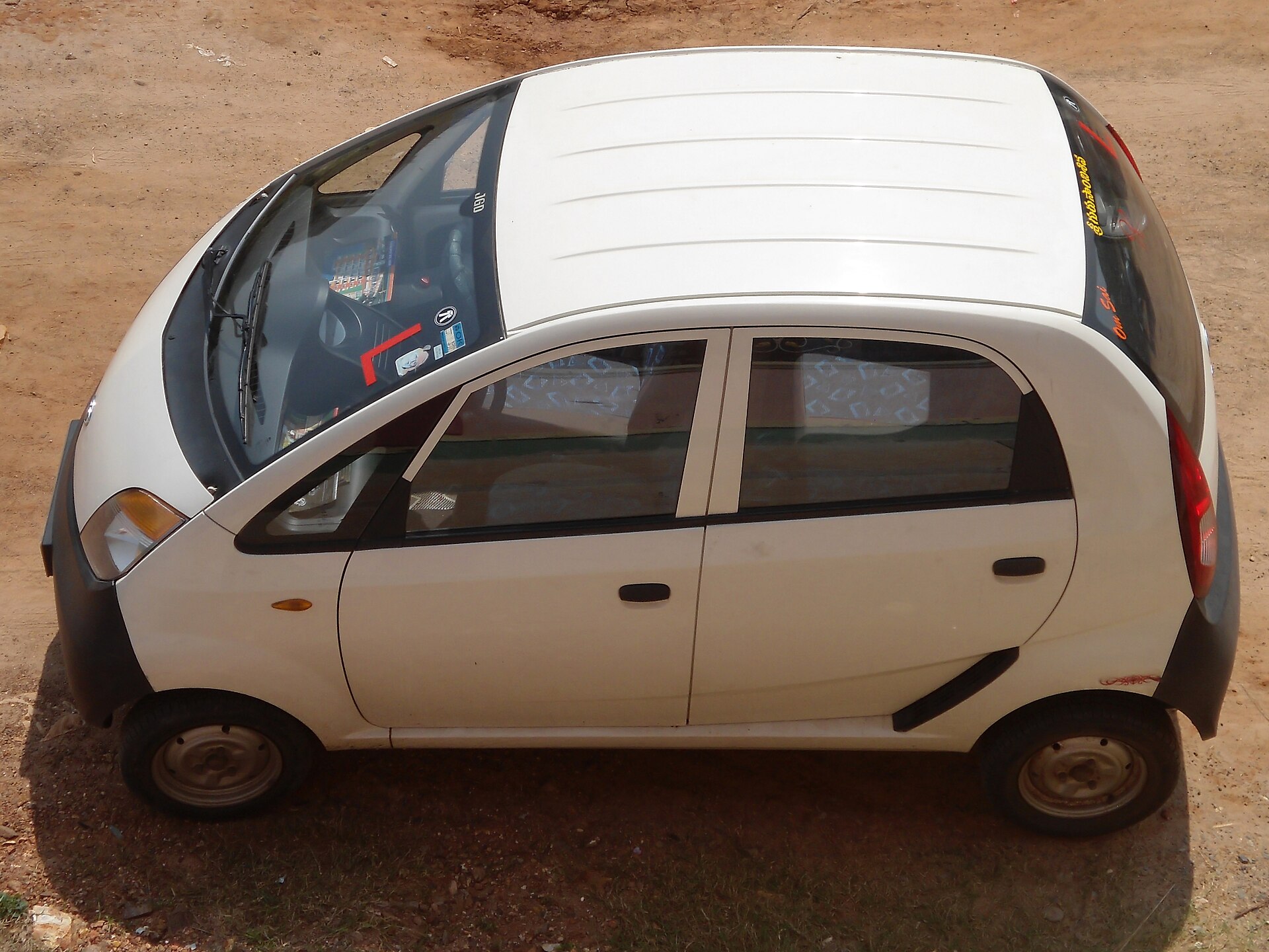 Tata Nano city car at Kommadi, matching the article's subject.