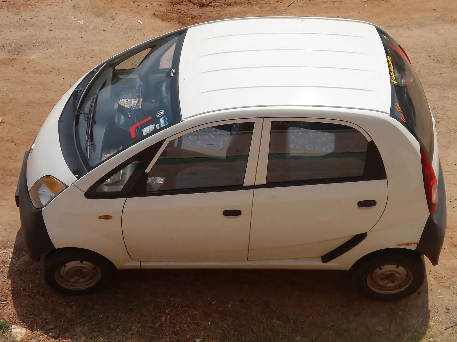 Tata Nano city car at Kommadi, matching the article's subject.