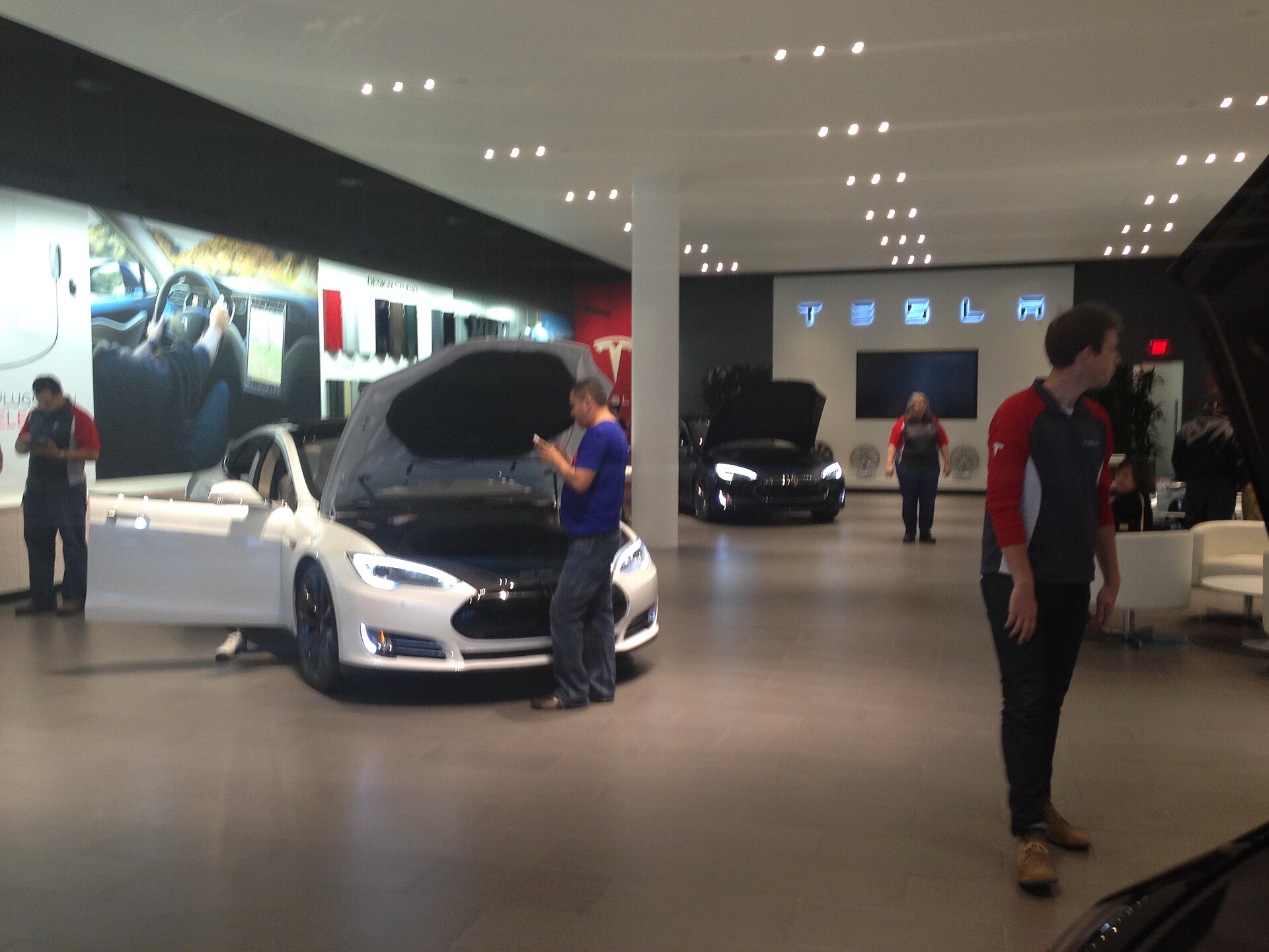 Tesla showroom, Santana Row, showing Tesla vehicles on display.