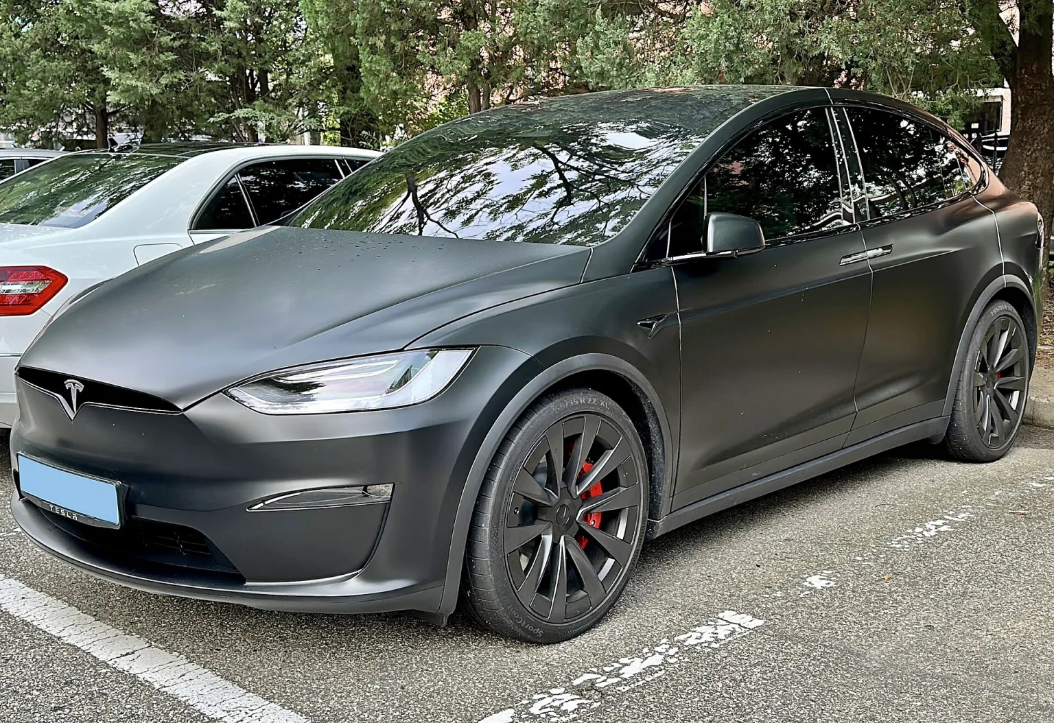 2016 Tesla Model X in white, front and side view