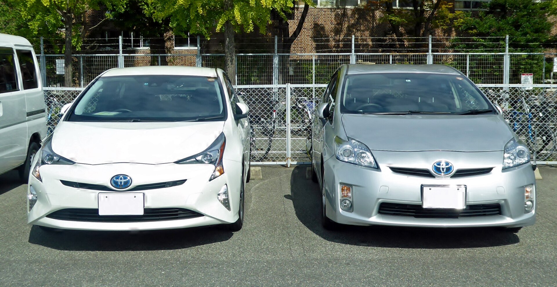 Both third and fifth generation Toyota Prius shown side by side.