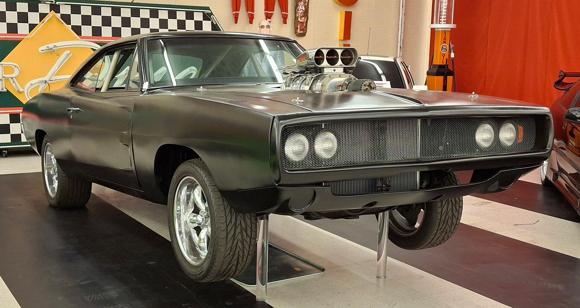 Dominic Toretto's 1970 Dodge Charger from Fast & Furious on display at a museum.