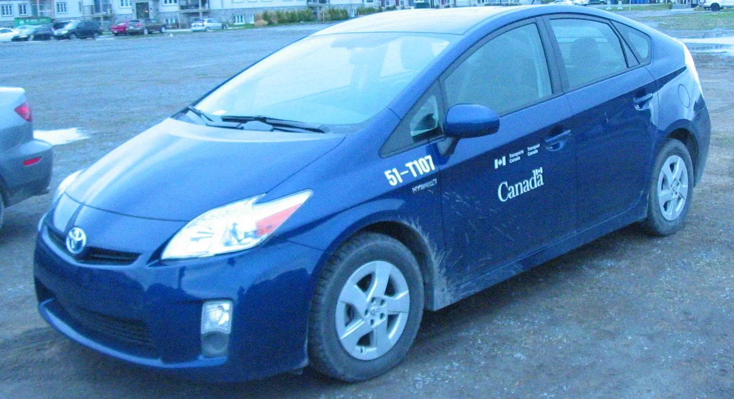 Toyota Prius, Toyota Venza, Honda Civic, and Ford Escape in a parking lot.