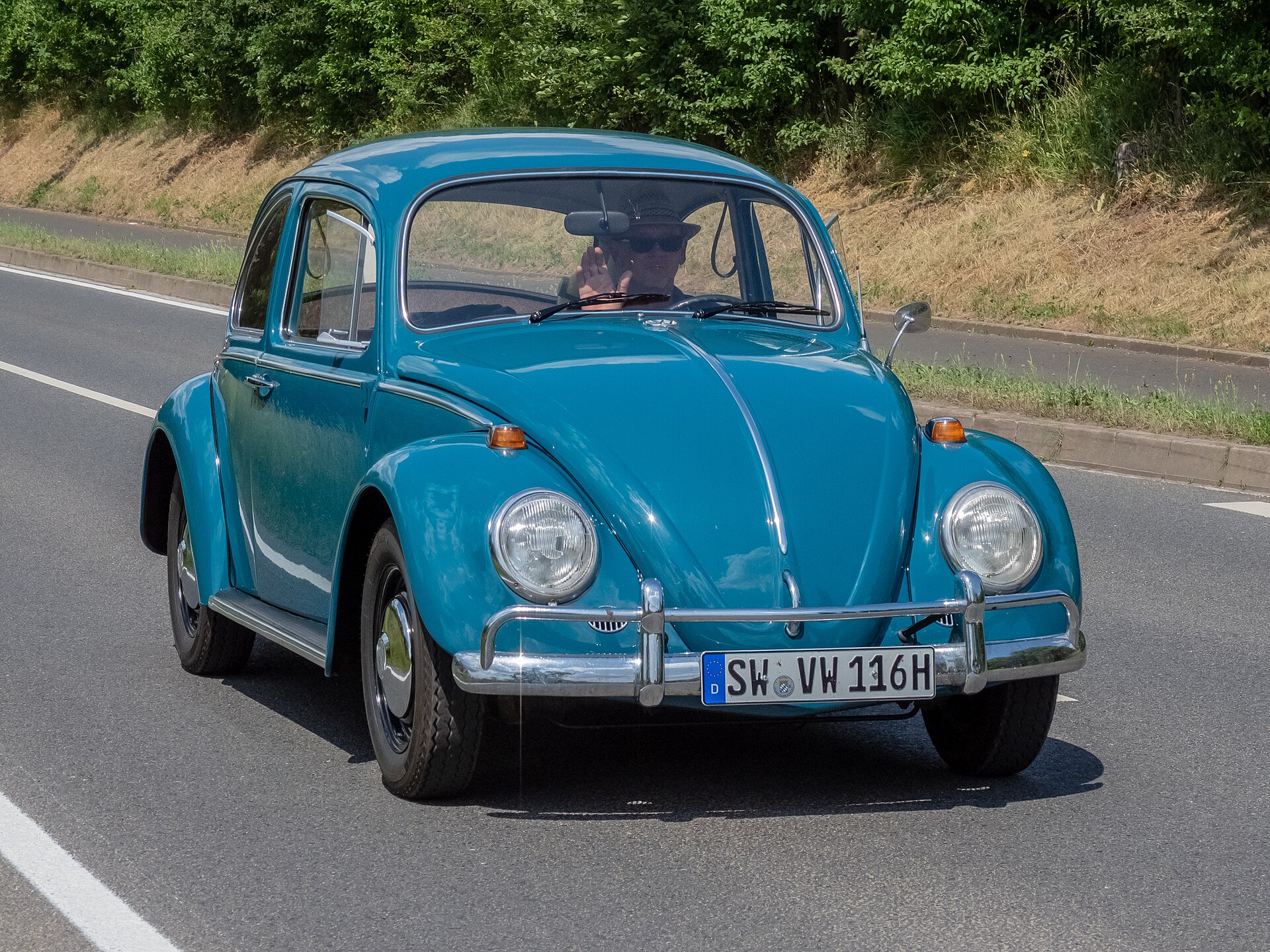 Classic Volkswagen Type 1 Beetle, rear-engined, as referenced in the article.