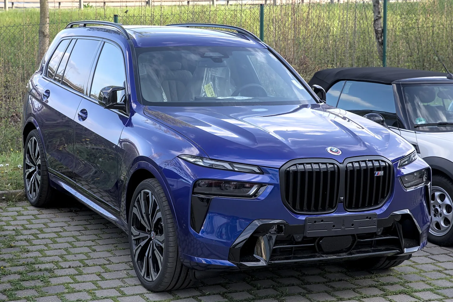 BMW X7 M60i SUV in a studio setting