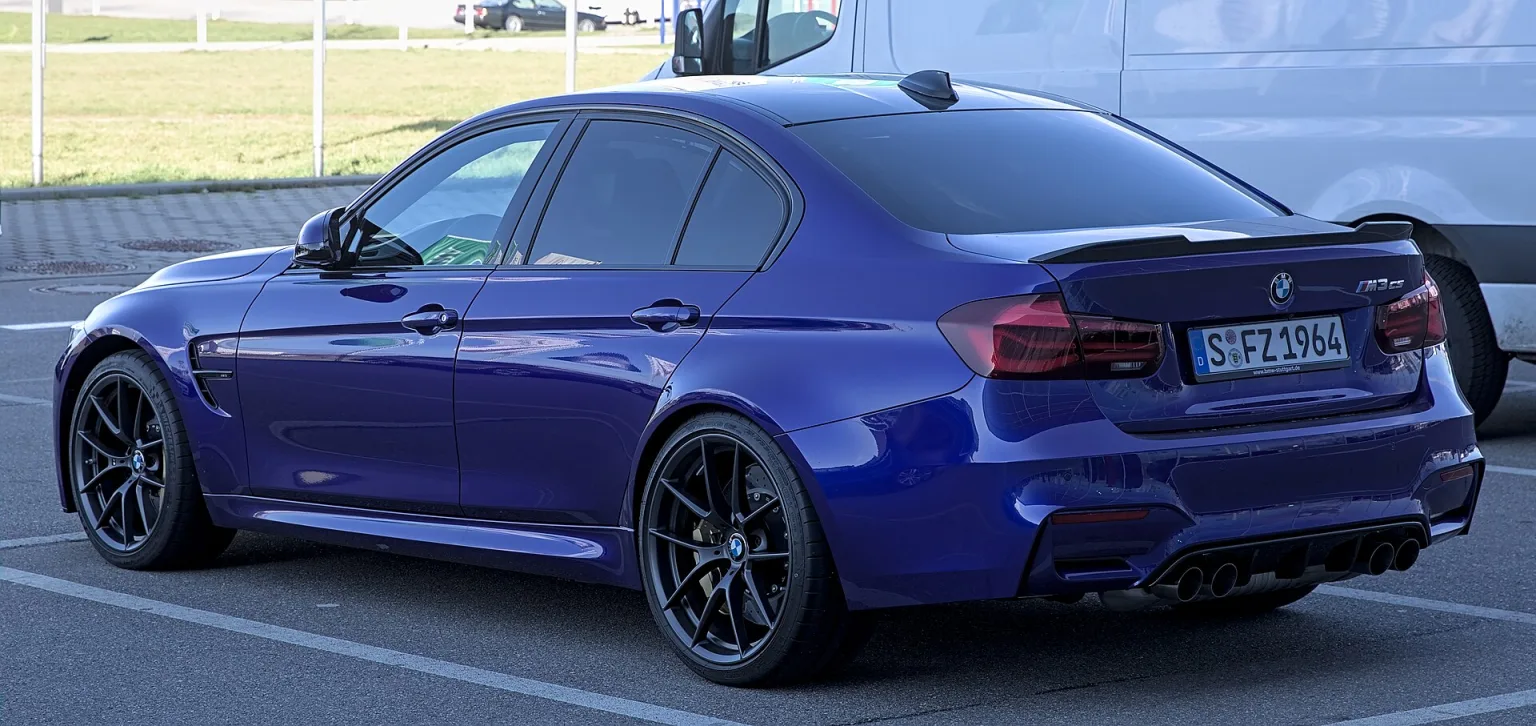 BMW M3 CS in blue, parked on the street