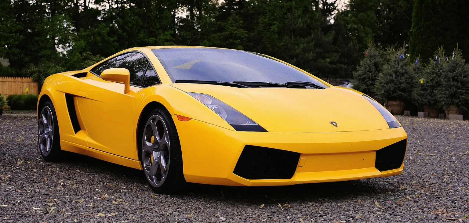 Yellow Lamborghini Gallardo coupe on the road