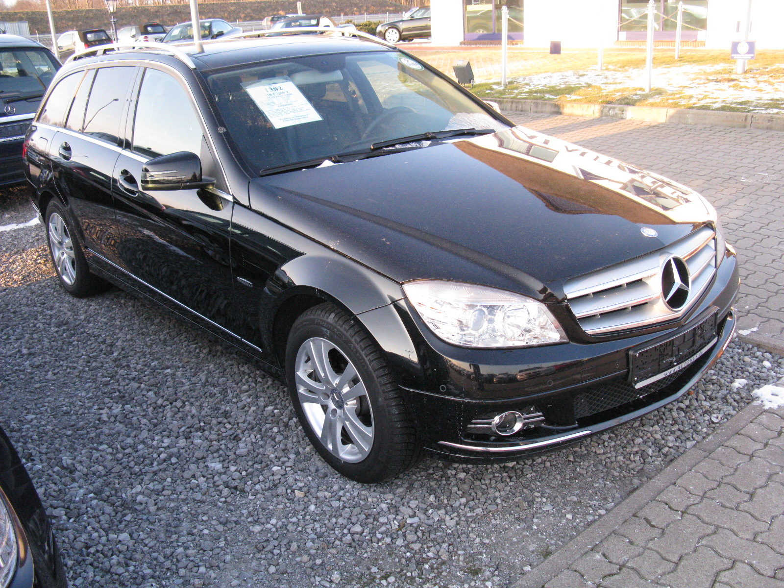 Mercedes-Benz C200 T CDI W204 in silver, parked on the street