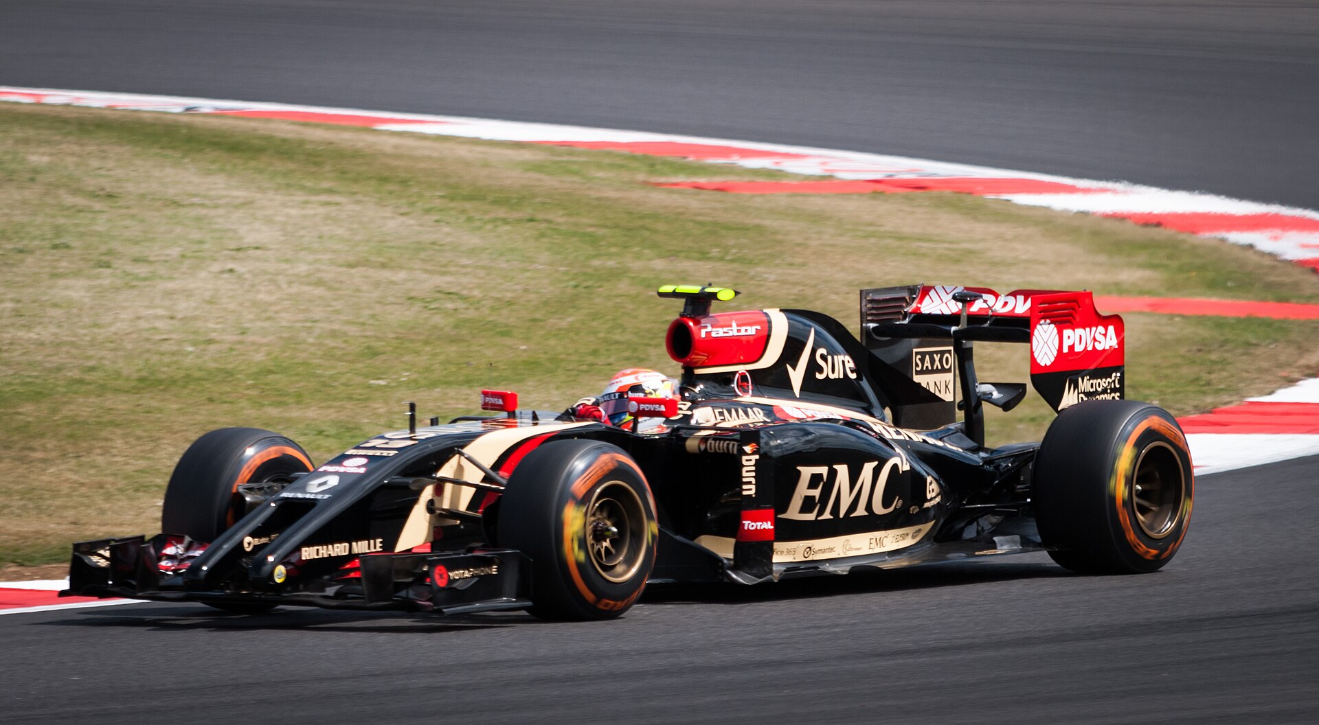 Pastor Maldonado driving the Lotus E22 at Silverstone in 2014
