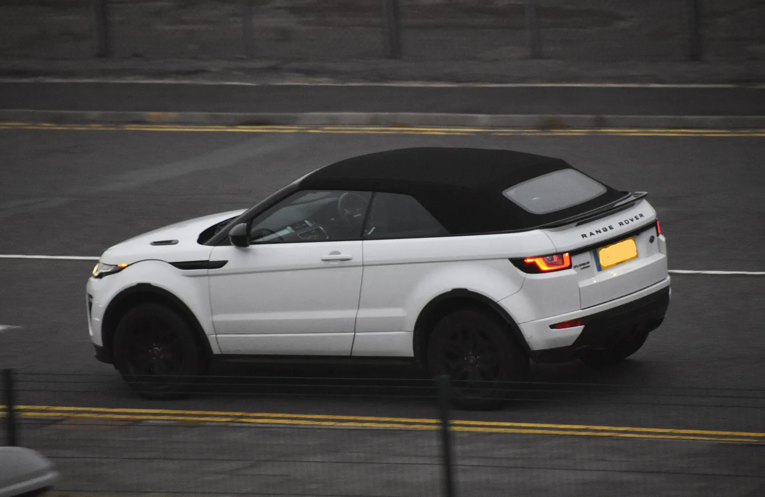 Range Rover Evoque Cabriolet with roof down, front three-quarter view
