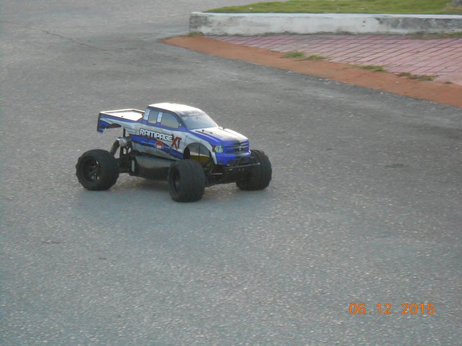 A modern radio-controlled car on pavement