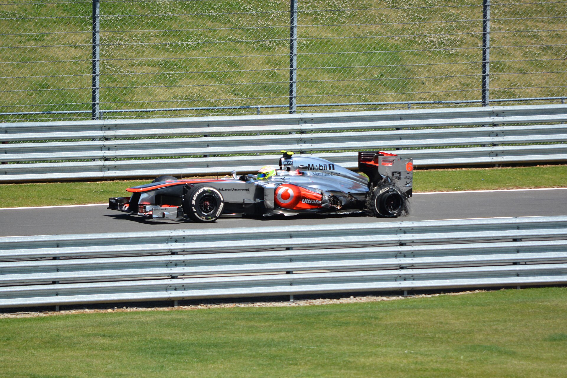 Sergio Pérez driving the McLaren MP4-28 in the 2013 British Grand Prix