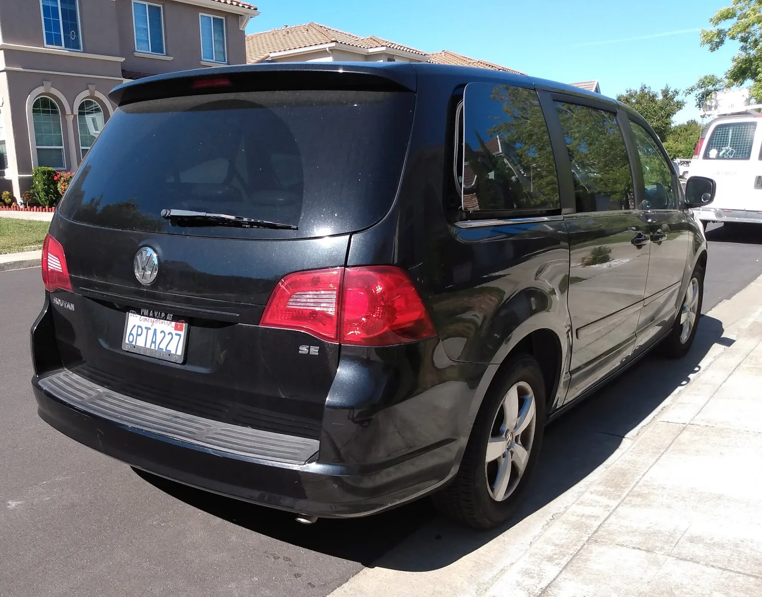 2011 Volkswagen Routan SE minivan in a press-style outdoor setting